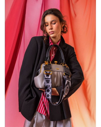 Double-sided bag with a detachable butterfly