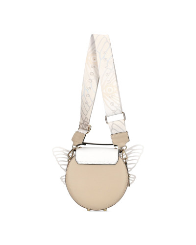 Okrągła torebka z odpinanymi skrzydłami zapakowana w pudełko